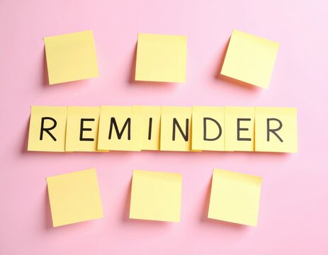 Yellow sticky notes spelling reminder word with blank notes on pink background for task management concept