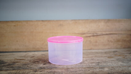 Plastic cookie jar with clear lid for storing snacks or homemade cookies, perfect for kitchen organization and food storage