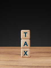 Tax concept with wooden cubes showing the word TAX and percent symbols arranged like stairs. Finance, accounting, and tax rate increase idea.