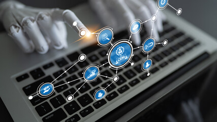 A futuristic representation of robotic hands interacting with a laptop, highlighting the importance of data management and technology in modern customer relationship systems. Tessel