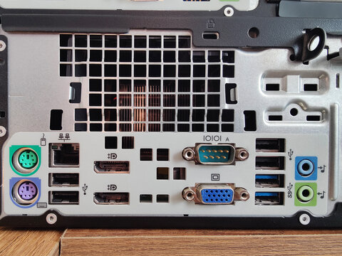Extreme Close-Up of the Rear I/O Panel of a Desktop Computer (Small Form Factor PC), Displaying a Variety of Ports Including PS/2, Ethernet, USB, DisplayPort, and VGA Connectors.