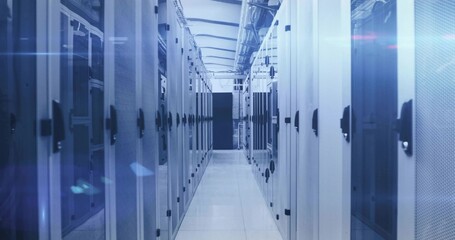 Showing central aisle extending through data center equipment room, with server racks, cable trays