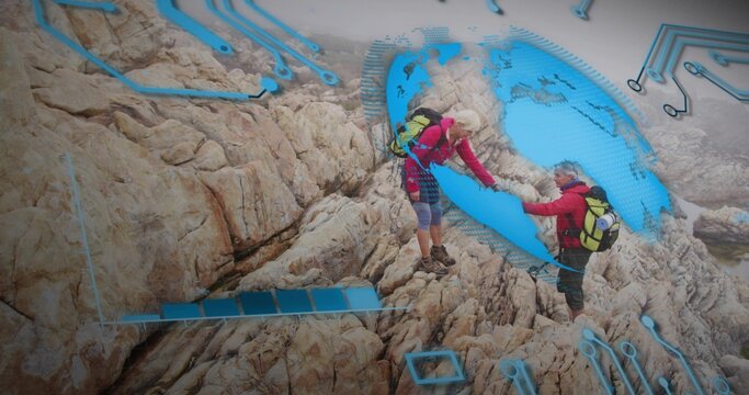 Assisting senior hikers scaling rock face, with red jackets, boots, packs and digital circuit globe