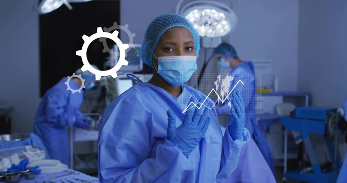 Raising gloved hands female surgeon preparing for surgery in operating room, with digital overlay