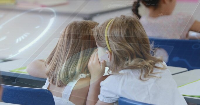 Whispering blonde schoolgirl leaning close at blue classroom desk with notebooks, paper and pencils