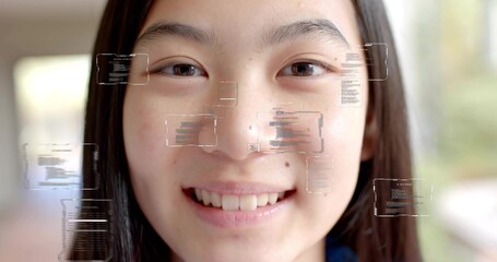 Smiling Chinese teenage girl interacting with code panels in bright hallway, with AR overlay