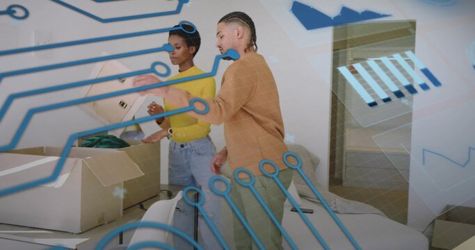 Unpacking moving couple sorting items from cardboard box in modern living room, with tech graphics