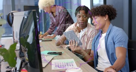 Examining men in striped and blue shirts studying tablet and charts at office desk, AR overlay