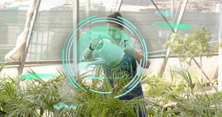Watering gardener in blue apron with white watering can, inspecting pots in greenhouse with teal AR