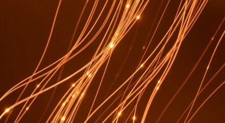 Glowing fiber optic cables transmit data in a dark room, creating a futuristic and technological atmosphere with bright light trails and blurred motion effects.