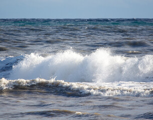 The ocean is rough and the waves are high