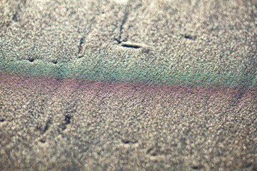 Abstract background of sand surface with green and red stripes
