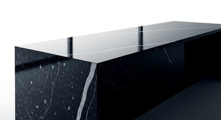 Sleek black marble countertop with elegant white veining, reflecting light in a modern interior setting.