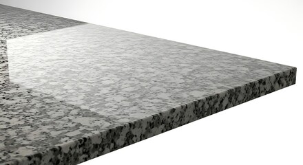 Close-up view of a polished granite countertop with a speckled gray and black pattern, showcasing its smooth, reflective surface and beveled edge.