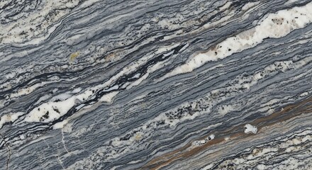 A close-up, diagonal view of a polished granite slab with swirling patterns of gray, black, and white.
