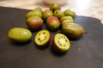 Hardy kiwi berries showing fresh green flesh