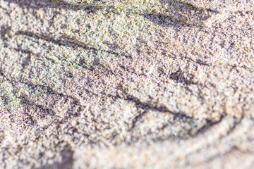 Abstract background of a sandy surface with lines and shadows
