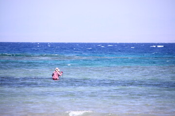 Bedouin woman walking in Sinai, Red Sea traditional Middle Eastern culture and lifestyle