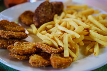 Crispy chicken and golden fries on a plate