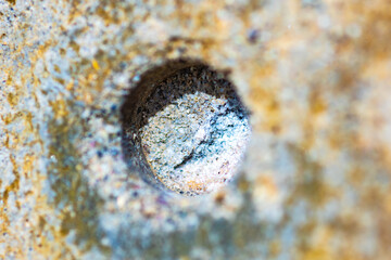 Abstract background of a round indentation in a concrete wall, macro.
