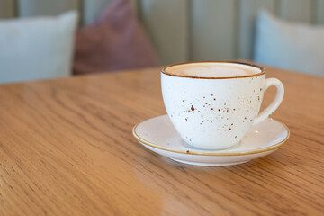 The perfect start to the day, a cup of aromatic cappuccino with a heart-shaped foam