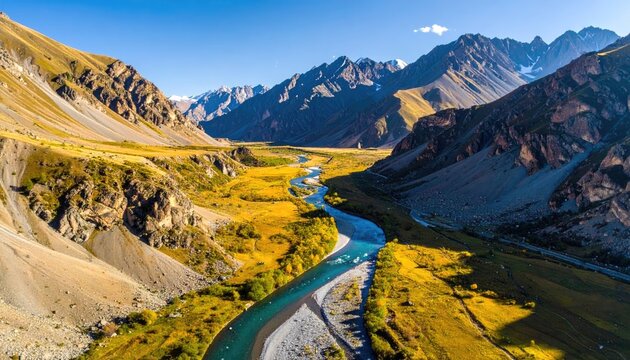 Serene Mountain Valley With A Winding River Under A Clear Blue Sky And Golden Sunlight Illuminating The Autumn Foliage
