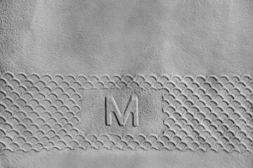 Rubber letter M sign