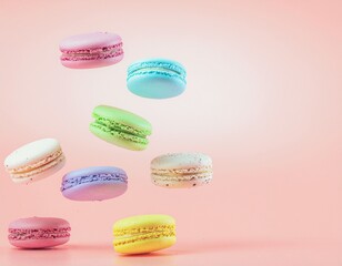 Colorful French Macarons Floating on Pastel Pink Background