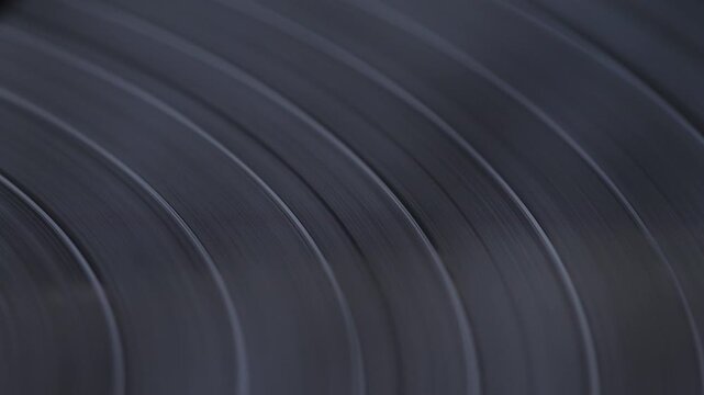  close-up of a vinyl record spinning, vintage gramophone record in player, macro vinyl record texture