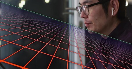 Tech expert shifting tablet, inserting earbud and viewing grid evolving red to purple for analysis - Powered by Adobe