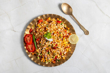 "Jhalmuri", a spicy Bengali street snack made with puffed rice, mustard oil, onions, chilies, and tangy spices for crunch and flavor.
