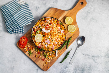 "Jhalmuri", a spicy Bengali street snack made with puffed rice, mustard oil, onions, chilies, and tangy spices for crunch and flavor.
