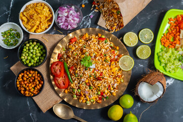 "Jhalmuri", a spicy Bengali street snack made with puffed rice, mustard oil, onions, chilies, and tangy spices for crunch and flavor.
