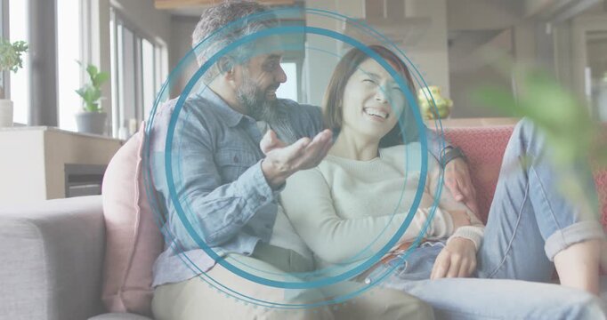 Mature man raising palm and initiating scanning animation around smiling partner showing AR feature