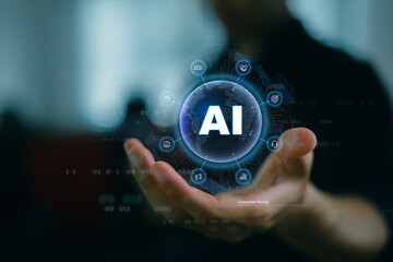 Artificial Intelligence innovation concept: Human hand holding glowing AI digital sphere with technology icons, symbolizing machine learning, data analytics, automation, and future smart technology. © sarawut