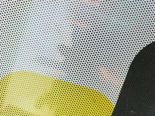 Close-up view at One Way Vision sticker film with dot pattern on glass. White and yellow concept design © Orotnub