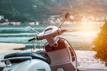 Modern urban scooter on lakeside road