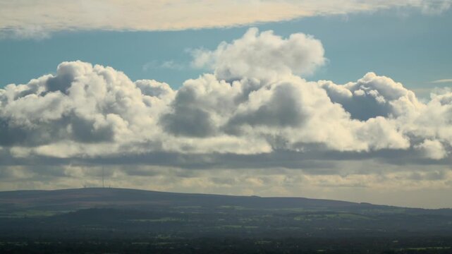 Cumulonimbus And Nimbus Clouds Gathering Over Low Hills Of English Countryside. Time Lapse 60x Normal Speed.