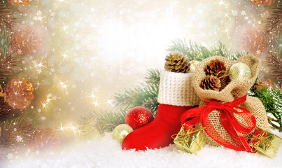 Christmas background with decorative Santa red boot and gift bag and box, branch and pine cones for tree decoraton. New Year winter holidays fantasy concept with decor and copy space.
