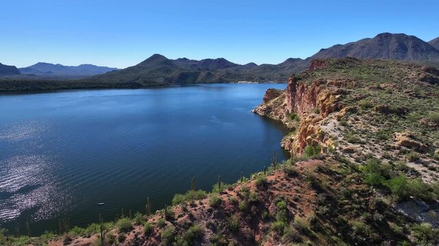 Aerial view of the tranquil Butcher Jones Beach where the azure water meets the rugged terrain, creating a stunning contrast of colors, Butcher Jones Beach Site, Arizona, United States.