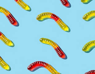 Colorful Gummy Worm Candies on Bright Blue Background