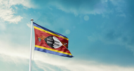 Eswatini national flag fluttering. The flag blowing in beautiful soft sky. Eswatini national flag for independence day.