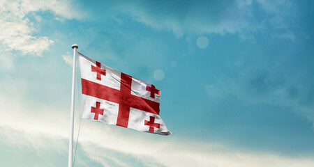 Georgia national flag fluttering. The flag blowing in beautiful soft sky. Georgia national flag for independence day.