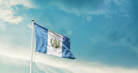 Guatemala national flag fluttering. The flag blowing in beautiful soft sky. Guatemala national flag for independence day.