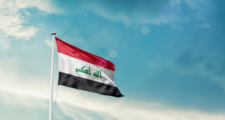 Iraq national flag fluttering. The flag blowing in beautiful soft sky. Iraq national flag for independence day.