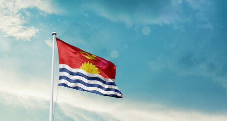 Kiribati national flag fluttering. The flag blowing in beautiful soft sky. Kiribati national flag for independence day.