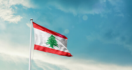 Lebanon national flag fluttering. The flag blowing in beautiful soft sky. Lebanon national flag for independence day.