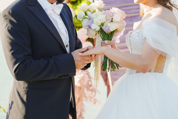 Couple exchanging vows during a beautiful beach wedding