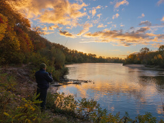 fisherman on the river with rod