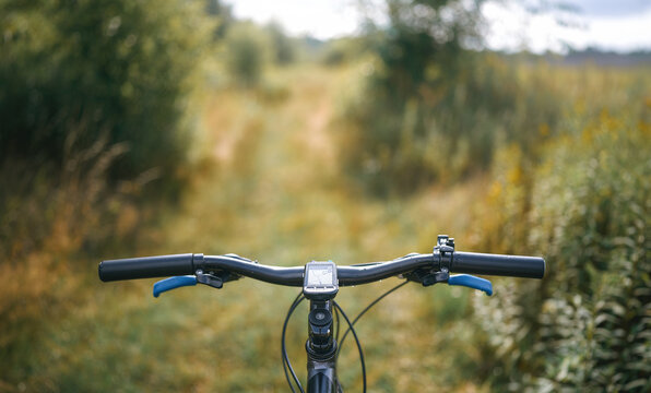 Biker??Ts hand on handlebar riding downhill